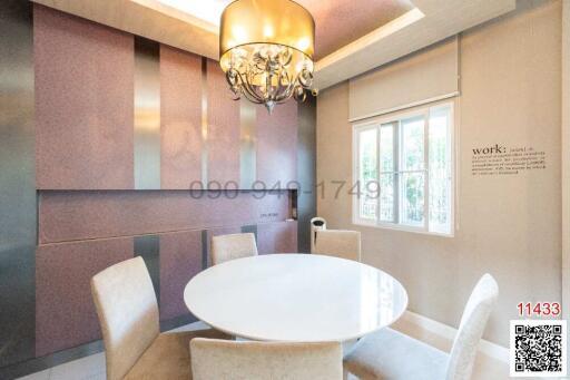 Elegant dining room interior with white round table and upholstered chairs