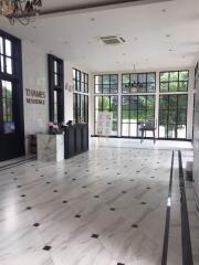 Spacious lobby with marble flooring and large windows