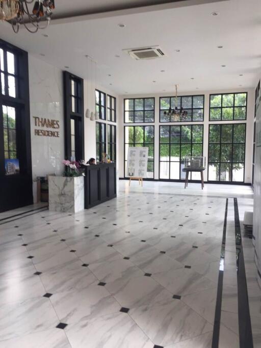 Spacious lobby with marble flooring and large windows