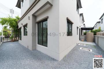 Exterior view of a modern home with gravel landscaping