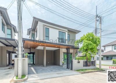 Modern two-story house with spacious garage and neat exterior