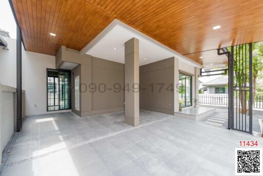 Spacious modern entryway with high ceiling and natural light