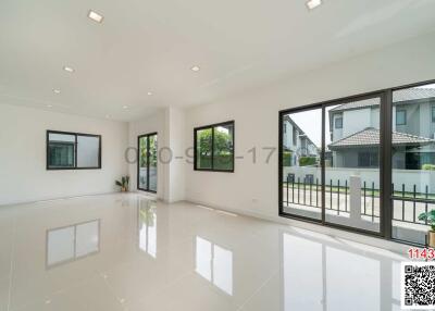 Spacious and well-lit living room with large windows