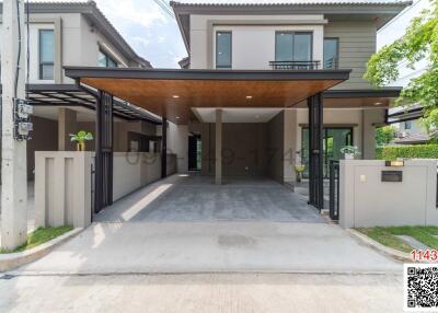 Modern two-story house with a spacious driveway and covered entrance