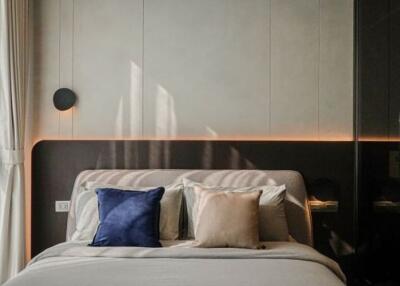 Modern bedroom with stylish decor and ambient lighting