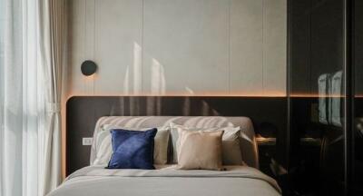 Modern bedroom with stylish decor and ambient lighting