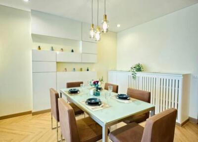 Modern dining room with elegant table set and wooden flooring