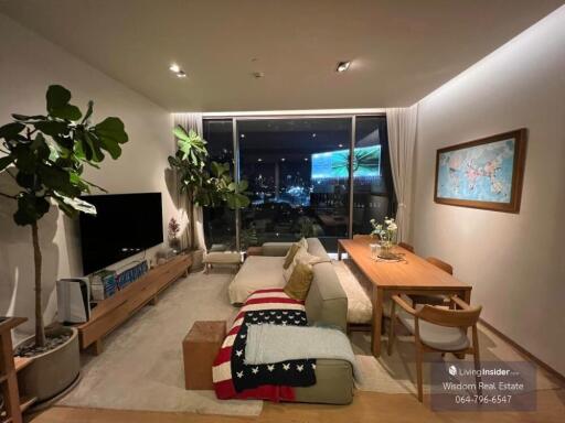 Cozy and well-lit living room interior with city view