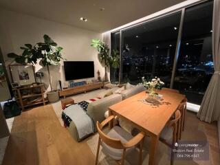 Cozy living room with city view at night