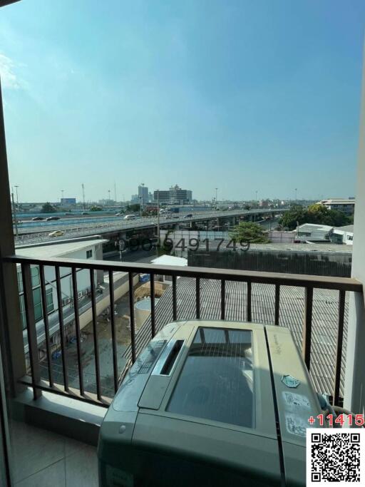 Spacious balcony with city view and outdoor air conditioning unit