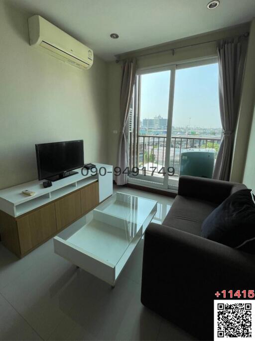 Bright and cozy living room with modern furniture and balcony access