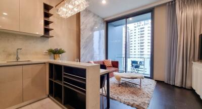 Modern kitchen with an open plan dining area leading onto a balcony