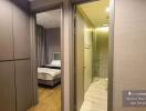 Cozy bedroom with en suite bathroom entry view