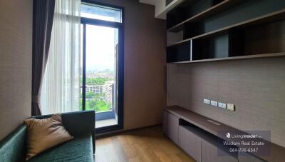 Cozy bedroom with large window and built-in shelving