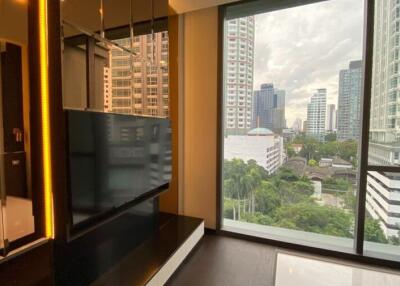 Modern living room with large windows offering a city view