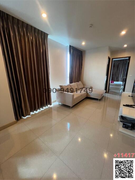 Modern bedroom with large windows and tiled flooring