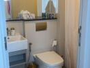 Modern bathroom with marble floor and well-lit vanity area