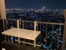 High-rise apartment balcony with cityscape view at night