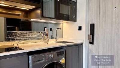 Modern kitchen with stainless steel appliances and smart home system