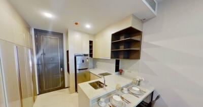 Modern kitchen with built-in appliances and shelving