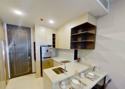 Modern kitchen with stainless steel appliances and ample shelving