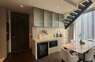 Modern kitchen with dining area in a high-rise apartment