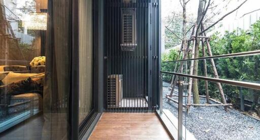 Modern balcony with large glass windows and outdoor view