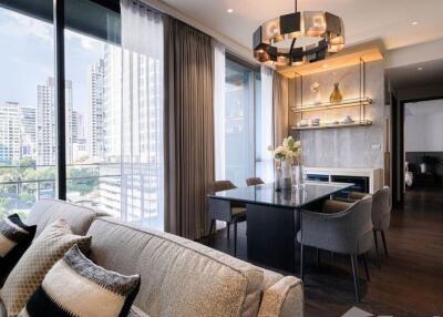 Modern living room with dining area and city view