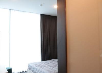 Modern furnished bedroom with ample natural light