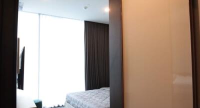 Modern furnished bedroom with ample natural light