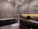 Modern bathroom interior with marble tiles, glass shower, and bathtub