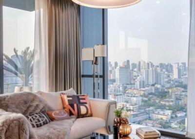 Stylish living room with floor-to-ceiling windows overlooking the cityscape