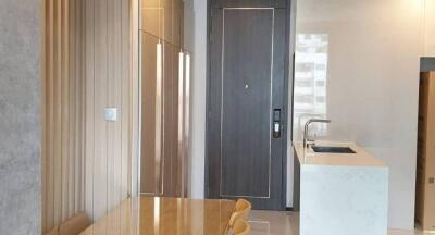 Modern kitchen interior with sleek countertops and wooden accents