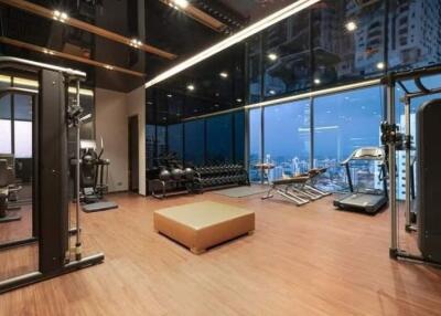 Home gym with modern equipment and city view