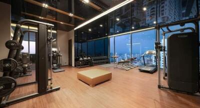 Home gym with modern equipment and city view