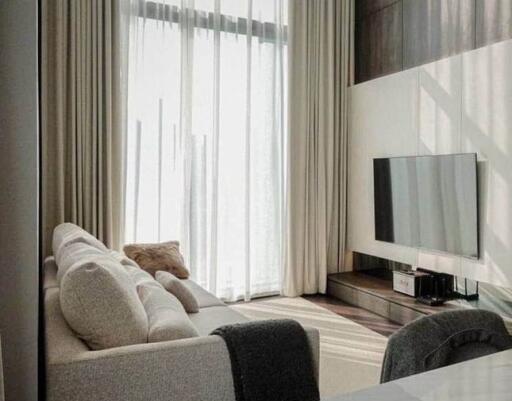 Modern living room interior with comfortable sofa and flat-screen TV