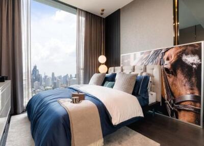 Modern bedroom with city view and artistic decor