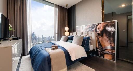 Modern bedroom with city view and artistic decor