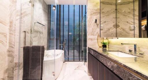 Modern bathroom interior with marble finish and elegant fixtures