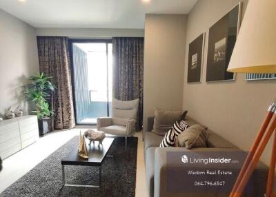 Modern furnished living room with natural light