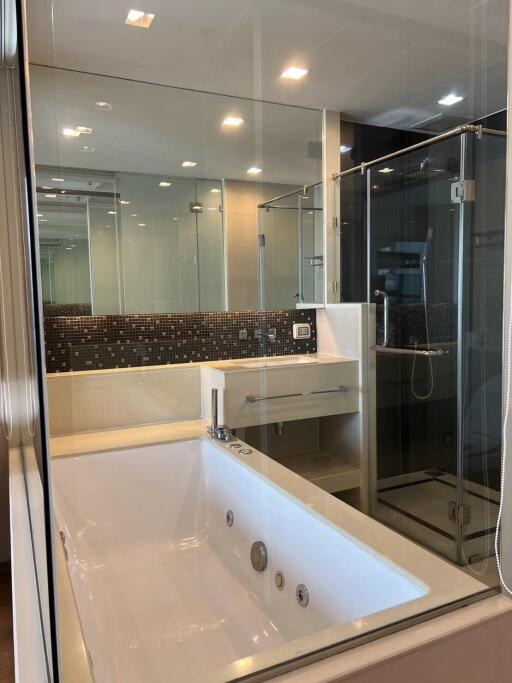 Modern bathroom with glass shower and bathtub