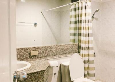 Modern bathroom interior with tile finish and standard fixtures