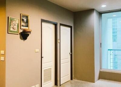 Well-lit hallway with neutral tones