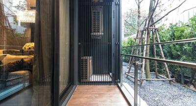 Modern balcony with glass barrier and garden view