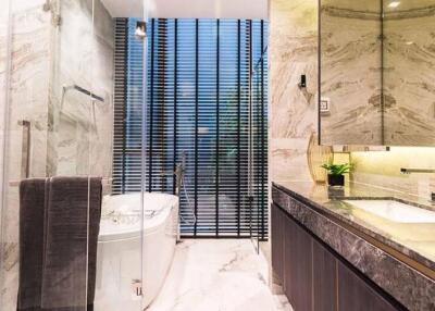 Modern bathroom with marble finish and elegant fixtures