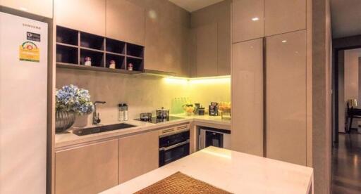 Modern kitchen with stainless steel appliances and ambient lighting