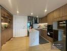 Modern kitchen with bar counter and wooden cabinets in a residential apartment