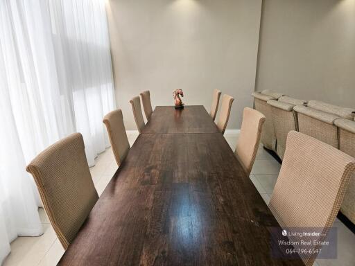 Spacious dining room with large table and comfortable chairs