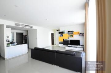 Spacious living room with integrated kitchen area