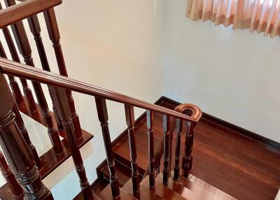 Elegant wooden staircase with polished handrails and steps